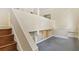 Bright hallway featuring tile floors, neutral walls, and a staircase leading to the lower level at 2840 Peachtree Nw Rd # 307, Atlanta, GA 30305