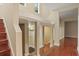 Hallway with hardwood floors, staircase, and access to storage area at 2840 Peachtree Nw Rd # 307, Atlanta, GA 30305