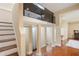 Hallway with hard wood floors leading to the stairs and featuring design elements and a unique upper glass feature at 2840 Peachtree Nw Rd # 307, Atlanta, GA 30305