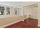 Bright hallway with hardwood floors, neutral walls, and windows providing natural light at 2840 Peachtree Nw Rd # 307, Atlanta, GA 30305