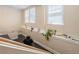 Bright hallway featuring stylish tile floors, a wide window, and a charming plant display at 2840 Peachtree Nw Rd # 307, Atlanta, GA 30305
