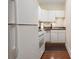 A modern kitchen with white cabinetry and stainless steel appliances at 2840 Peachtree Nw Rd # 307, Atlanta, GA 30305