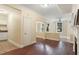 Inviting living room with hardwood floors, neutral paint, and an ornate fireplace at 2840 Peachtree Nw Rd # 307, Atlanta, GA 30305