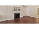 Charming living room featuring hardwood floors, neutral paint, and a fireplace at 2840 Peachtree Nw Rd # 307, Atlanta, GA 30305