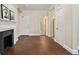 Classic living room with hardwood floors, a fireplace, and multiple doorways leading to other rooms at 2840 Peachtree Nw Rd # 307, Atlanta, GA 30305