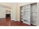 Living room featuring hardwood floors, a fireplace, and built-in shelves at 2840 Peachtree Nw Rd # 307, Atlanta, GA 30305
