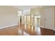 Spacious living room featuring hardwood floors, neutral walls, and multiple doorways leading to other rooms at 2840 Peachtree Nw Rd # 307, Atlanta, GA 30305
