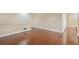 Cozy living room featuring hardwood floors, neutral walls, and a white door to the outside at 2840 Peachtree Nw Rd # 307, Atlanta, GA 30305
