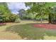 Expansive backyard featuring lush greenery and mature trees, perfect for outdoor enjoyment at 627 New England Way, Lawrenceville, GA 30046