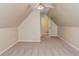Spacious bonus room with plush carpeting, a window, and a ceiling fan at 627 New England Way, Lawrenceville, GA 30046