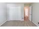 Bedroom with a closet and an open doorway at 627 New England Way, Lawrenceville, GA 30046