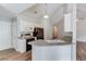 An eat-in kitchen featuring a peninsula and white cabinetry at 627 New England Way, Lawrenceville, GA 30046