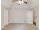 Bright main bedroom showcasing a tray ceiling, ceiling fan, and two closets at 627 New England Way, Lawrenceville, GA 30046