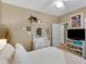 A bedroom featuring a vintage dresser, a shelved wall decoration, and neutral paint at 1466 Lake Forest Ln, Mcdonough, GA 30253