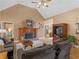 Cozy living room featuring fireplace, hardwood floors, and comfortable seating arrangement at 1466 Lake Forest Ln, Mcdonough, GA 30253