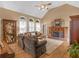 Comfortable living room features vaulted ceiling, hardwood floors, fireplace, and ample seating at 1466 Lake Forest Ln, Mcdonough, GA 30253