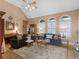Bright living room with hardwood floors, vaulted ceiling, and comfortable seating at 1466 Lake Forest Ln, Mcdonough, GA 30253