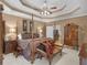 This main bedroom features a four post bed, lamps on bedside tables, a seating bench and antique wooden furniture at 1466 Lake Forest Ln, Mcdonough, GA 30253