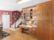 This home features built in wooden cabinets, a desk and drawers that provide plenty of storage and an organized office space at 1466 Lake Forest Ln, Mcdonough, GA 30253