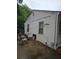Side view showing the home's exterior with white siding and windows at 4253 Hanes Dr, Decatur, GA 30035