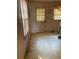 A view of a kitchen featuring a window, door, and dirty floor at 4253 Hanes Dr, Decatur, GA 30035