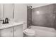 Bathroom features a shower and tub combo with tiled walls and contemporary fixtures at 4448 Denise Dr, Decatur, GA 30035