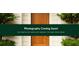 Close up of an inviting stained wood front door framed by meticulously maintained shrubs, conveying a warm welcome at 4448 Denise Dr, Decatur, GA 30035