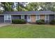 Charming single story home with a stone facade and a well-manicured front lawn, exuding curb appeal at 4448 Denise Dr, Decatur, GA 30035
