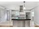 The kitchen is large with stainless steel appliances, an island, and room for bar seating at 4448 Denise Dr, Decatur, GA 30035