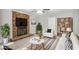 Cozy living room with a brick fireplace, comfortable seating, and a stylish rug at 4448 Denise Dr, Decatur, GA 30035