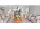Open concept living room featuring hardwood floors and easy access to the gourmet kitchen at 4448 Denise Dr, Decatur, GA 30035
