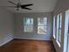 Sunlit living room with hardwood floors and multiple windows, creating a bright and airy space to enjoy at 4448 Denise Dr, Decatur, GA 30035