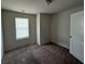 Bedroom featuring carpet and a window at 6474 Grey Fox Way, Riverdale, GA 30296