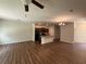 Spacious living room with hardwood floors, kitchen and a dining area at 6474 Grey Fox Way, Riverdale, GA 30296
