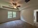 Main bedroom features a tray ceiling, carpet and an en suite bathroom at 6474 Grey Fox Way, Riverdale, GA 30296