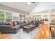 Open concept living room with stylish furniture, vaulted ceilings, and seamless access to the kitchen at 6895 Old Fox Trl, Stone Mountain, GA 30087