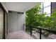 Private balcony offers views of the city and lush greenery at 867 Peachtree Ne St # 202, Atlanta, GA 30308