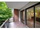 Balcony offering city views through floor-to-ceiling windows and glass railings at 867 Peachtree Ne St # 202, Atlanta, GA 30308