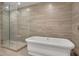 Freestanding tub and glass-enclosed shower create a spa-like bathroom at 867 Peachtree Ne St # 202, Atlanta, GA 30308