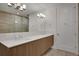 Contemporary bathroom with double sinks, quartz countertop, and decorative lighting at 867 Peachtree Ne St # 202, Atlanta, GA 30308