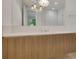 Modern bathroom featuring a beautiful chandelier, vanity and shower at 867 Peachtree Ne St # 202, Atlanta, GA 30308