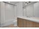 Bathroom with modern vanity, neutral tiling, and shower and tub combo at 867 Peachtree Ne St # 202, Atlanta, GA 30308