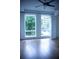 Bedroom boasting hardwood floors, two large windows, and a ceiling fan at 867 Peachtree Ne St # 202, Atlanta, GA 30308