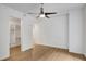 Bright bedroom features hardwood floors, a ceiling fan, and a walk-in closet at 867 Peachtree Ne St # 202, Atlanta, GA 30308