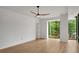 Cozy bedroom with large window and fan offering natural light and comfortable living space at 867 Peachtree Ne St # 202, Atlanta, GA 30308