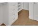 Bright walk-in closet with custom storage, drawers, and shelving at 867 Peachtree Ne St # 202, Atlanta, GA 30308