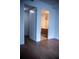 Entryway boasting hardwood floors, an open door and a partial view of a bathroom at 867 Peachtree Ne St # 202, Atlanta, GA 30308