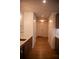 Hallway featuring wood floors and access to kitchen amenities at 867 Peachtree Ne St # 202, Atlanta, GA 30308