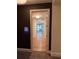 Elegant hallway with hardwood floors and white trim, leading to living area at 867 Peachtree Ne St # 202, Atlanta, GA 30308