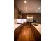 Gourmet kitchen features stainless steel appliances, island and custom cabinetry at 867 Peachtree Ne St # 202, Atlanta, GA 30308